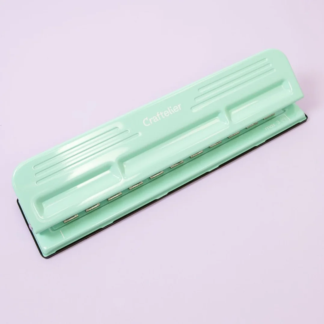 Craftelier - Perforatrice 11 orifices pour Planners, Agendas ou Carnets de Disques pour Scrapbooking et Loisir Créatif | Perfore jusqu'à 3 Feuilles de 90 g/m2 | Dim.Approx. 32 x 9 x 5 cm